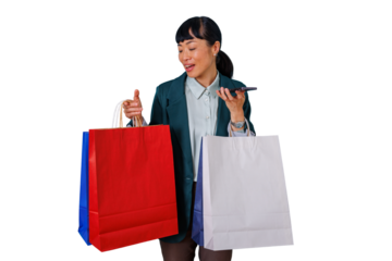 Asian woman holding shopping bags and using smartphone for voice message, enjoying shopping spree, transparent background