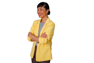 Mature asian businesswoman standing with arms crossed, smiling confidently, wearing a yellow blazer. Transparent background