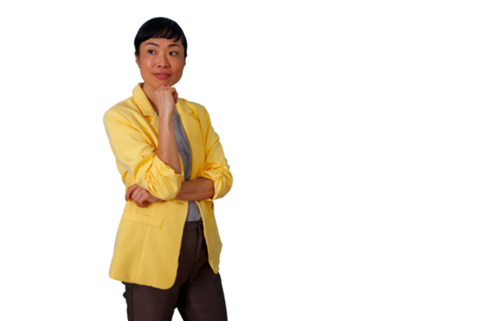 Asian businesswoman in yellow blazer thinking, looking away, contemplating business ideas, transparent background - Powered by Adobe