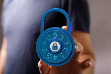 Secure digital padlock held in the hand. Representing privacy, safety, and online security. Data protection con