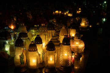 Candles on graves during All Saints' Day in Poland