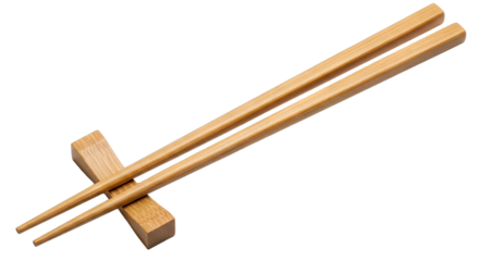 Pair of Natural Bamboo Chopsticks Resting on a Small Wooden Chopstick Rest on a Transparent Background Studio Shot