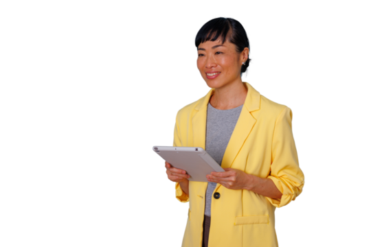 Asian businesswoman communicating and presenting using a digital tablet, looking away with a confident smile