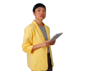 Asian businesswoman in yellow blazer using digital tablet for modern business and technology, transparent background