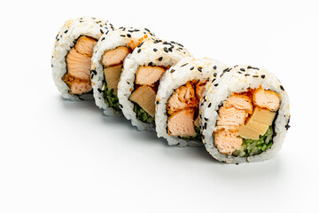 Sushi rolls with salmon and cucumber create a tempting display on a clean surface