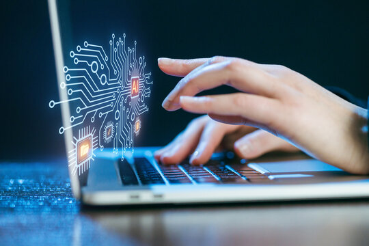 Exploring artificial intelligence on a laptop in a modern workspace setting with circuits and graphics