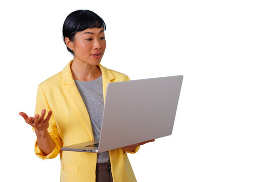 Asian businesswoman presenting, holding laptop and gesturing, explaining during a virtual meeting with transparent background