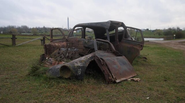 vintage vehicle with damaged parts, decayed sedan capturing interior and exterior features, archivist taking detailed photographs of abandoned car with broken panels and open doors