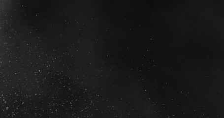 Falling snowflakes with fog. isolated on black background. Winter snow overlay texture for VFX, compositing, motion graphics and atmospheric effects