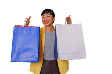 Happy asian woman shopping, holding blue and white paper bags with excitement, transparent background