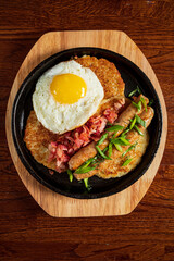 Enjoy a delicious breakfast featuring crispy bacon, sausage links, and a perfectly cooked egg