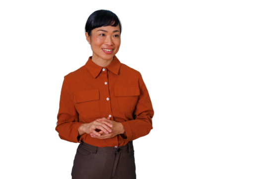 Confident asian businesswoman smiling while presenting, facing right with hands clasped, ready for overlay on diverse content