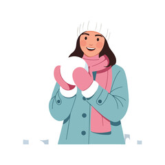 A smiling young woman dressed in winter clothes, including a hat, scarf, and coat, holding a snowball in her pink mittens.