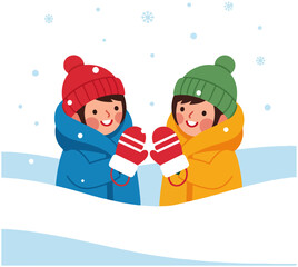 Two happy children wearing warm winter clothes playing in the snow with falling snowflakes.
