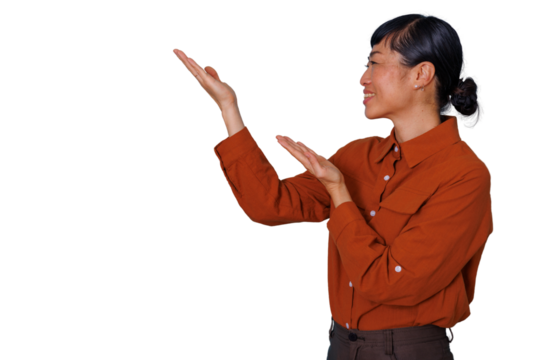Asian woman presenting and smiling, gesturing hands showing copy space for product or information, transparent background