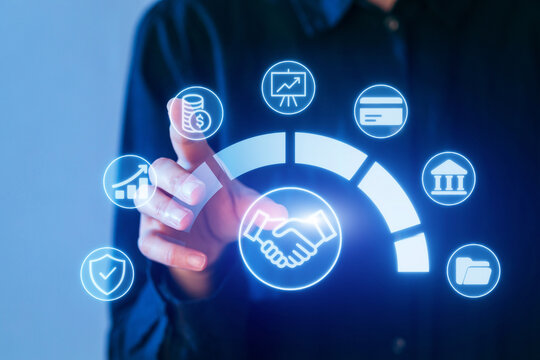 Business professional interacting with digital financial and analytical icons in a modern workspace setting