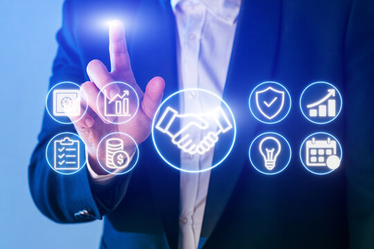 Business professional interacting with digital icons for growth, security, and innovation in a modern office setting