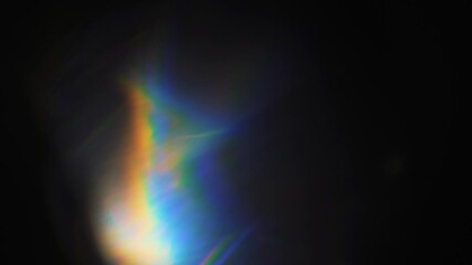 Abstract black motion background with subtle light leaks creating mysterious and cinematic atmosphere, perfect for film intros and evocative visuals