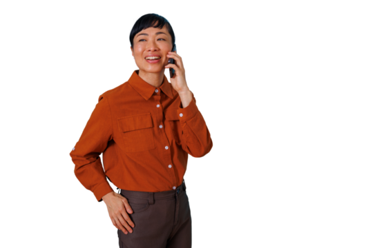 Smiling asian woman talking on mobile phone, having happy conversation, communicating, standing on transparent background - Powered by Adobe