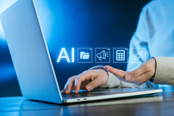 Technology drives innovation as a person interacts with AI tools on a laptop in a modern workspace