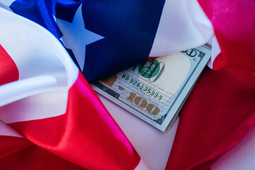 Money wrapped in flags symbolizes patriotism and financial success during celebration