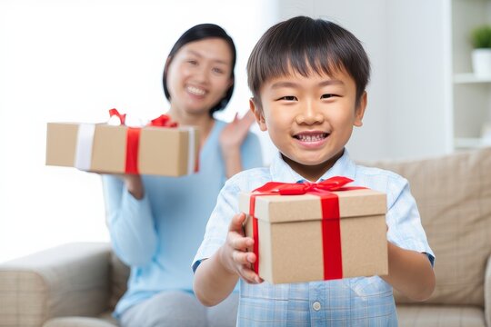 Excited Boy Presenting Gift with Happy Mother in Background
