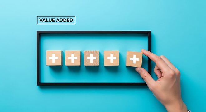 Hand adding value added wooden block in a frame on a blue background