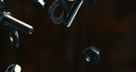 Slow Motion Macro Shot Of Metal Nuts And Bolts Floating Against A Dark Background, Revealing Industrial Texture, Rotational Motion, Metallic Highlights And Mechanical Rhythm At 1000 Fps.