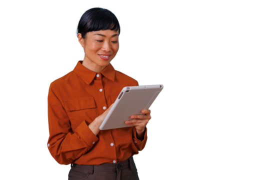Asian executive woman smiling and interacting with tablet, using digital technology for business communication - Powered by Adobe