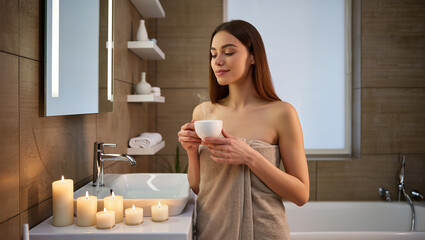 Relaxing After Bath: Woman In Towel Holding Hot Drink In Bathroom.