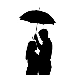 The silhouette of a couple sharing an umbrella