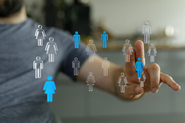 Hand touching icons representing people, social media concept, choice, connection, community, human resources a
