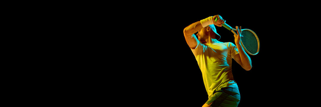 Tennis player in motion swinging racket under dramatic colored lighting. Concept of art photography, visual storytelling, energy flow, and creative composition in movement. Banner - Powered by Adobe