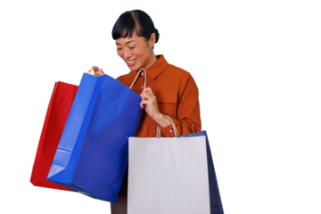 Asian woman happily unboxing purchases from multiple shopping bags, enjoying consumer retail experience on transparent background
