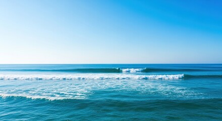 Obraz premium Vast Blue Ocean with Calm Waves and Clear Sky Background