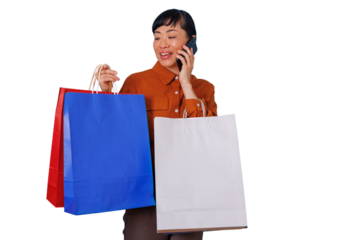 Happy asian woman shopping, talking on phone with multiple bags, enjoying retail therapy and modern communication