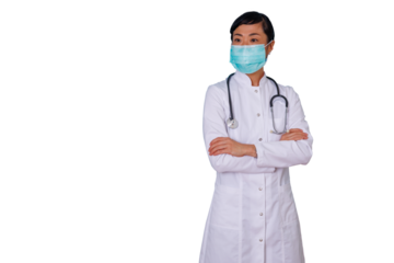Asian doctor woman wearing a surgical mask and white lab coat, arms crossed, looking away. Professional healthcare worker