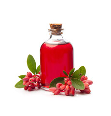 Barberry syrup in bottle and barberry berries