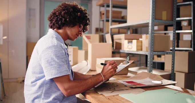 Man, reading and clipboard for ecommerce startup to check stock, supply chain and shipping details. Person, writing and documents on inventory checklist, quality assurance and order info for delivery