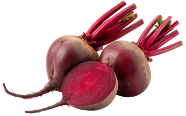 Fresh whole and halved beetroot with vibrant red flesh and green stems isolated on black background