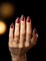 Close-up of female hands with stylish manicure against festive bokeh lights. Detailed nail design, glossy polish and elegant hand pose for beauty category.