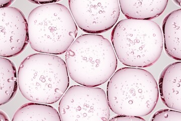 Macro shot of translucent pink gel beads with internal bubbles, perfect for beauty-focused ads, clean medical layouts, and polished abstract designs