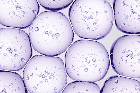 Detailed macro view of purple gel spheres with embedded bubbles, perfect for beauty-brand concepts, futuristic design assets, and science-inspired ads