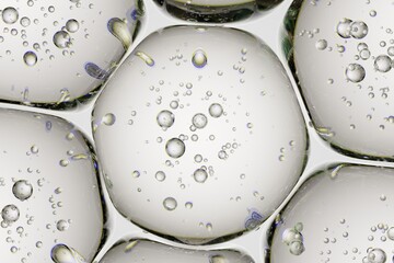Macro visualization of transparent bubbles interacting with gel-like structures, designed for scientific storytelling, premium branding, and abstract art
