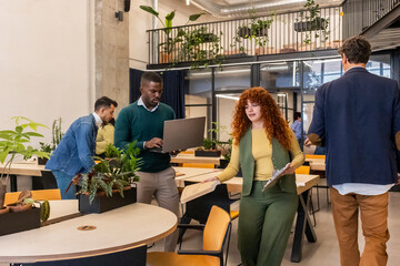 Diverse business professionals collaborating in modern coworking office