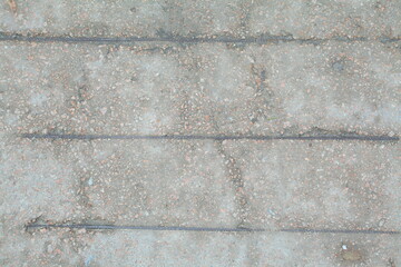 Concrete wall texture with rough surface and natural imperfections. Grey industrial background for design, construction concepts and architectural materials.