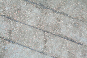 Obraz premium Concrete wall texture with rough surface and natural imperfections. Grey industrial background for design, construction concepts and architectural materials.