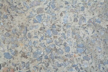 Concrete wall texture with rough surface and natural imperfections. Grey industrial background for design, construction concepts and architectural materials.