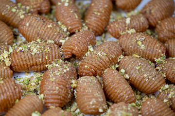 Lebanese recipe for Maakaroun fritters: fine wheat semolina, flour, butter, oil, ground anise. High quality photo