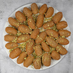 Lebanese recipe for Maakaroun fritters: fine wheat semolina, flour, butter, oil, ground anise. High quality photo